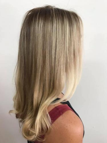 Beautiful blond hair color correction at beauty and the barber hair salon in cocoa beach